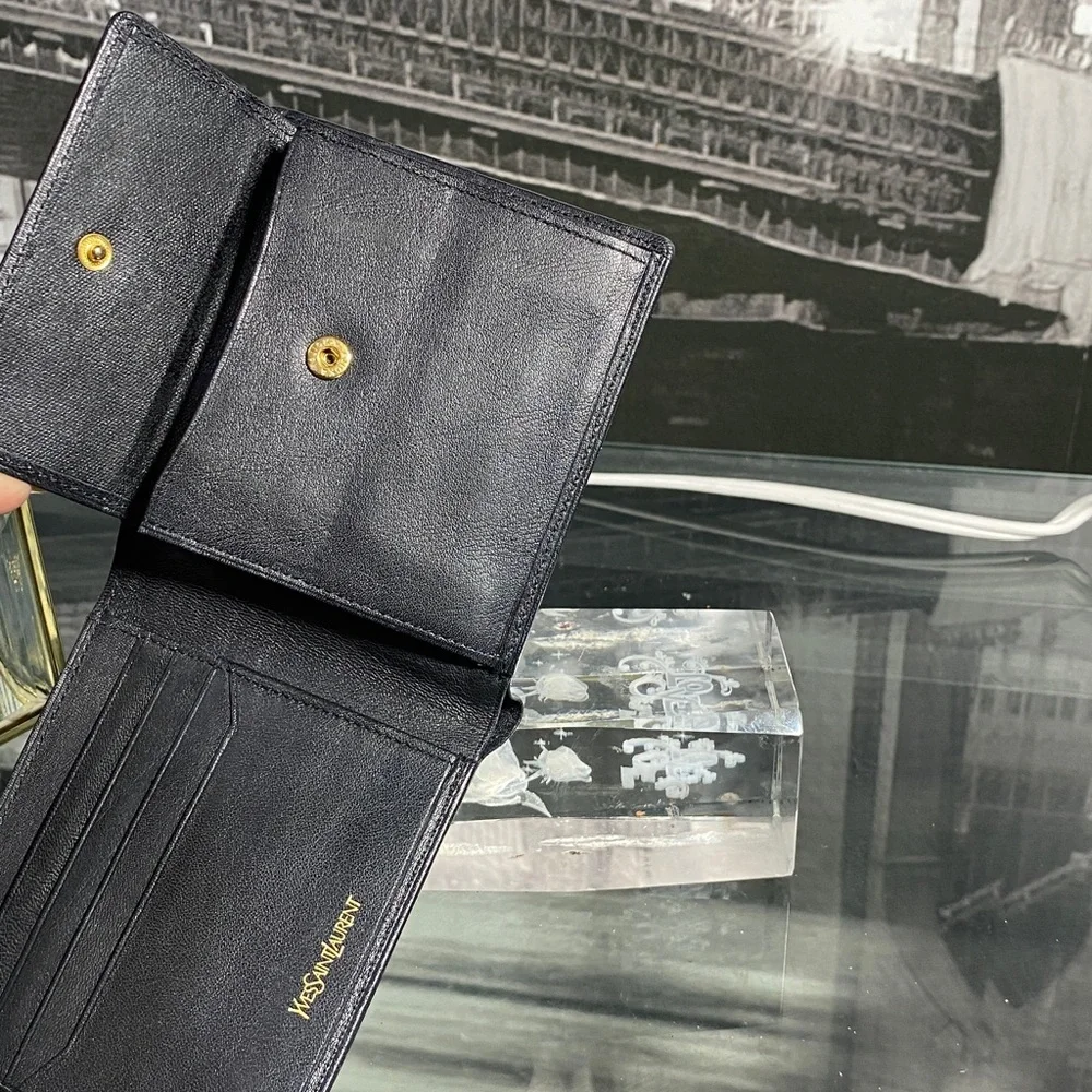 Authentic YSL Sleek black leather bifold wallet